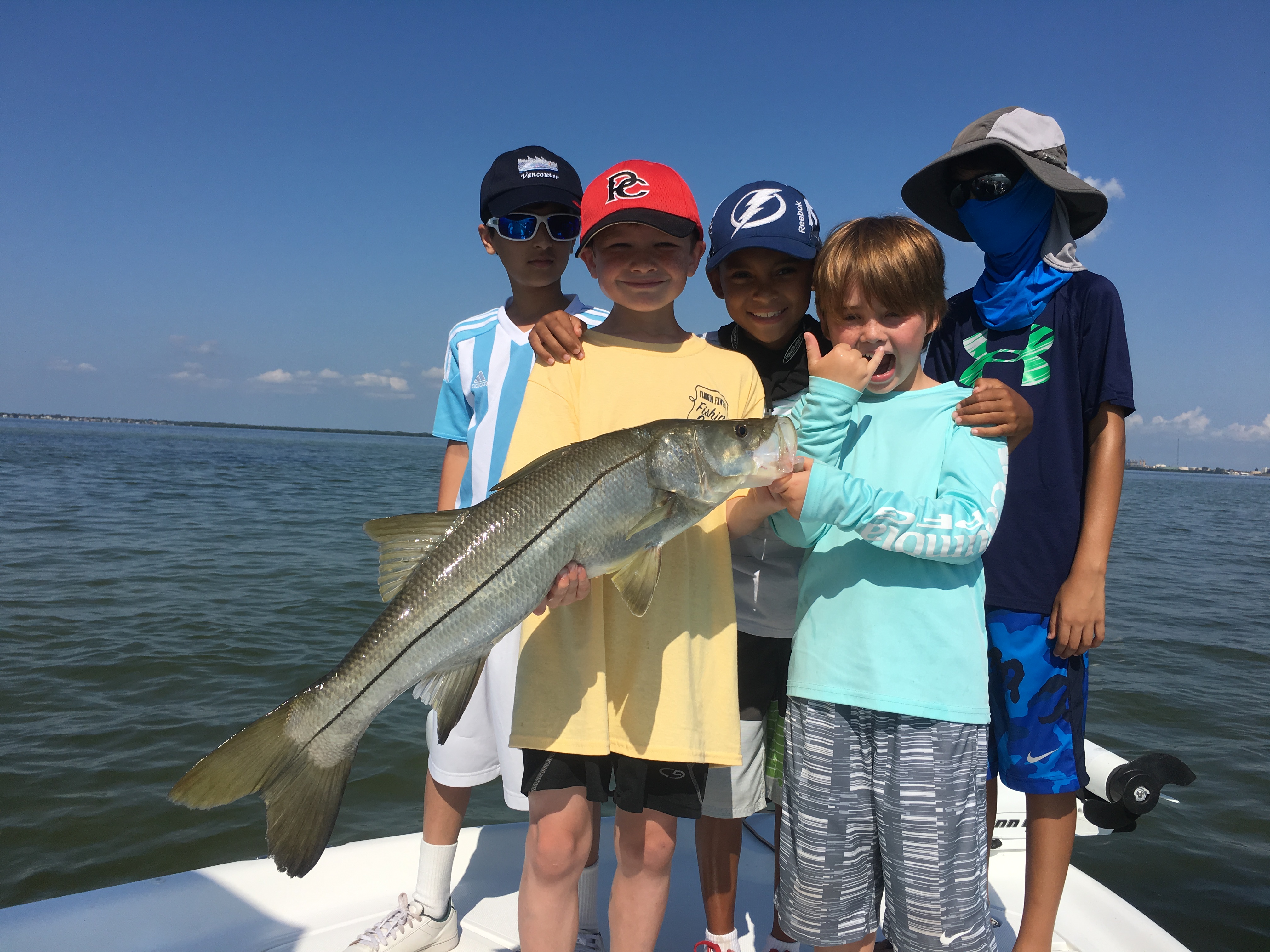 Kids catching a Snook in Tampa Bay